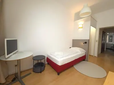 Ein Bett oder Betten in einem Zimmer der Unterkunft Aparthotel Amelie