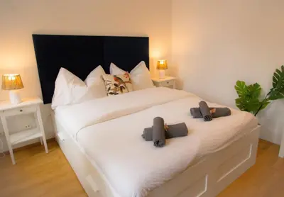 Ein Bett oder Betten in einem Zimmer der Unterkunft Urbane Oase l LF11
