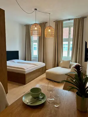 Ein Bett oder Betten in einem Zimmer der Unterkunft FERDI Ottakring