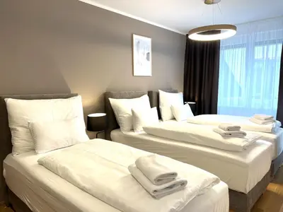 Ein Bett oder Betten in einem Zimmer der Unterkunft Free Parking - City Pulse Apartments at U6-Metro Vienna