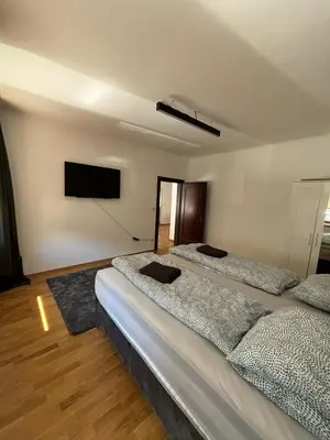Ein Bett oder Betten in einem Zimmer der Unterkunft Aveni Home