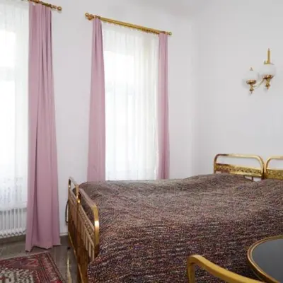 Ein Bett oder Betten in einem Zimmer der Unterkunft Klimtsuites