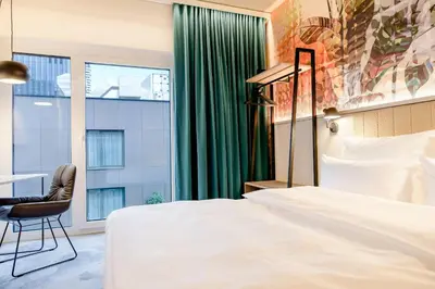 Ein Bett oder Betten in einem Zimmer der Unterkunft Motel One Wien-Donau City