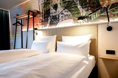 Ein Bett oder Betten in einem Zimmer der Unterkunft Motel One Wien-Donau City