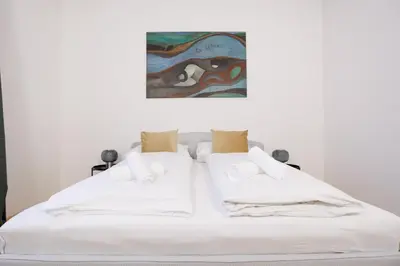 Ein Bett oder Betten in einem Zimmer der Unterkunft Belvedere City Apartment