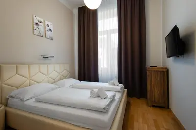 Ein Bett oder Betten in einem Zimmer der Unterkunft Tabor Residence