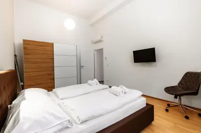 Ein Bett oder Betten in einem Zimmer der Unterkunft Tabor Residence