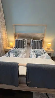 Ein Bett oder Betten in einem Zimmer der Unterkunft Enjoy Wien