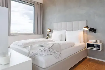 Ein Bett oder Betten in einem Zimmer der Unterkunft Exklusives Skyline-View Loft - Nähe Zentrum Wien
