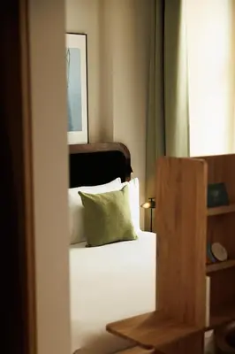 Ein Bett oder Betten in einem Zimmer der Unterkunft Wilde Vienna Fleischmarkt