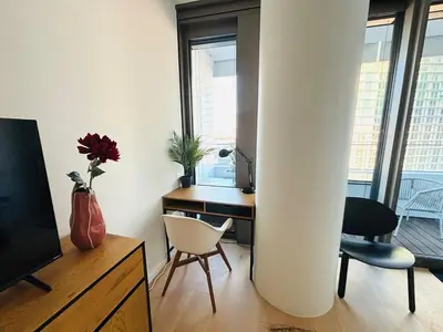 TV/Unterhaltungsangebot in der Unterkunft Modern apartment overlooking the skyline & Danube