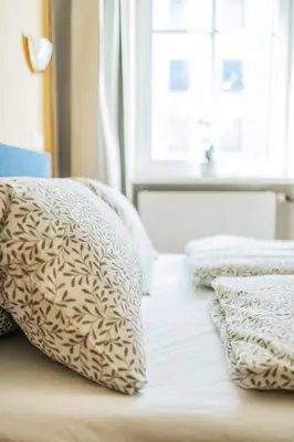 Ein Bett oder Betten in einem Zimmer der Unterkunft Vienna West Rooms