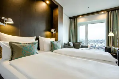 Ein Bett oder Betten in einem Zimmer der Unterkunft Motel One Wien-Hauptbahnhof