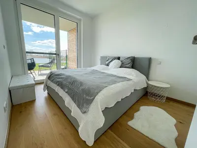 Ein Bett oder Betten in einem Zimmer der Unterkunft Ferienwohnung Seepark Oggau