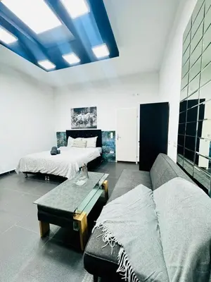 Ein Bett oder Betten in einem Zimmer der Unterkunft Studio Apartment For 3 People, 15 Minutes to Rathausplatz