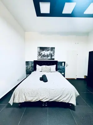 Ein Bett oder Betten in einem Zimmer der Unterkunft Studio Apartment For 3 People, 15 Minutes to Rathausplatz