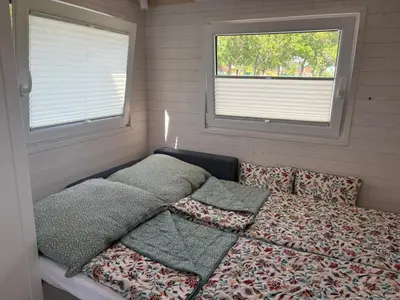 Ein Bett oder Betten in einem Zimmer der Unterkunft Tiny House am See
