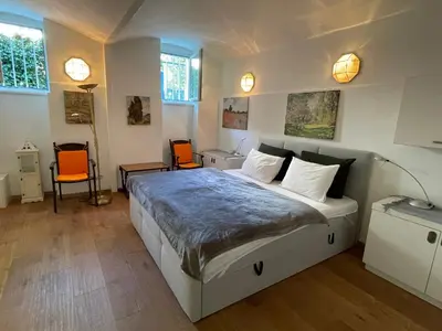 Ein Bett oder Betten in einem Zimmer der Unterkunft Skyvilla Wien - Gartenwohnung