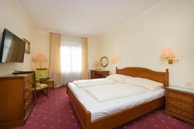 Ein Bett oder Betten in einem Zimmer der Unterkunft Pension Garden