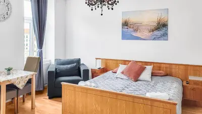 Ein Bett oder Betten in einem Zimmer der Unterkunft Adalbert Apartments