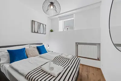 Ein Bett oder Betten in einem Zimmer der Unterkunft K22 Smart Rooms