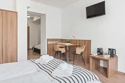 Ein Bett oder Betten in einem Zimmer der Unterkunft K22 Smart Rooms