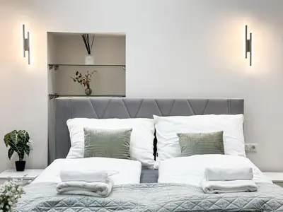 Ein Bett oder Betten in einem Zimmer der Unterkunft Apartment Grandeur in Vienna's City Center