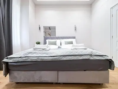 Ein Bett oder Betten in einem Zimmer der Unterkunft Apartment Grandeur in Vienna's City Center
