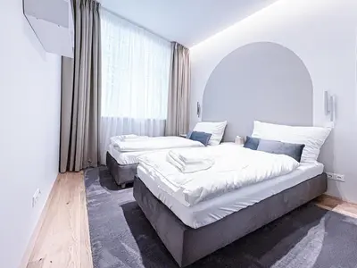 Ein Bett oder Betten in einem Zimmer der Unterkunft Apartment Charming in Vienna's City Center
