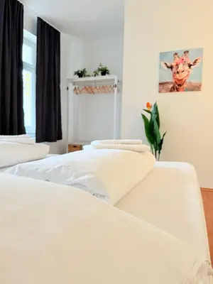 Ein Bett oder Betten in einem Zimmer der Unterkunft Duo & Friends Wien 20