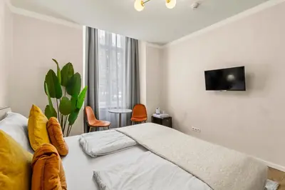 Ein Bett oder Betten in einem Zimmer der Unterkunft Votivpark Rooms I Self Check In