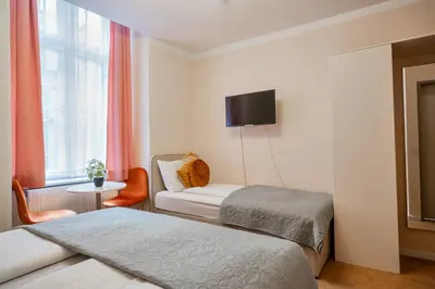 Ein Bett oder Betten in einem Zimmer der Unterkunft Votivpark Rooms I Self Check In