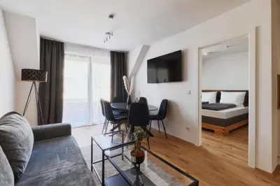 Ein Bett oder Betten in einem Zimmer der Unterkunft Symphony Apartments Vienna - Garden, Terrace and Grill