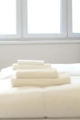 Ein Bett oder Betten in einem Zimmer der Unterkunft Margot