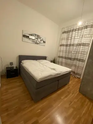Ein Bett oder Betten in einem Zimmer der Unterkunft Stilvolles Wohnen Taborstraße