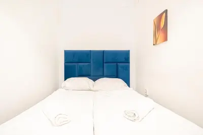 Ein Bett oder Betten in einem Zimmer der Unterkunft Central Belvedere 3BR Shared Apartment - 12 min from City Center