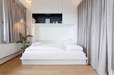 Ein Bett oder Betten in einem Zimmer der Unterkunft Penthouse-Flair with Skyline-View