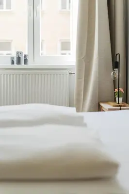 Ein Bett oder Betten in einem Zimmer der Unterkunft Smart Living Apartments - Favoriten