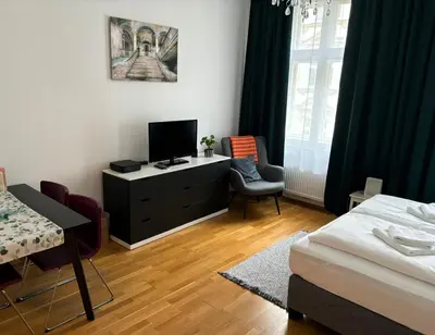 Ein Bett oder Betten in einem Zimmer der Unterkunft Casa Nostra - Ruhig & zentral wohnen am Augarten