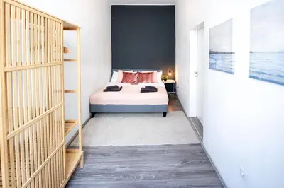 Ein Bett oder Betten in einem Zimmer der Unterkunft Comfortable Spacious Apartment by Hanovermarkt & the Danube