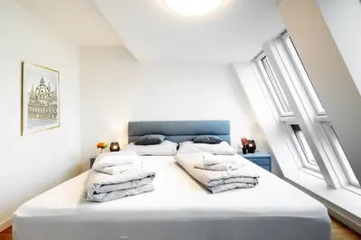Ein Bett oder Betten in einem Zimmer der Unterkunft Noble Penthouse Residences Vienna