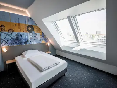 Ein Bett oder Betten in einem Zimmer der Unterkunft B&B HOTEL Wien-Heiligenstadt