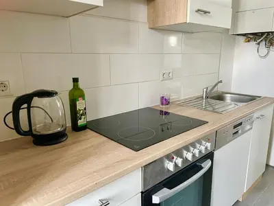 Küche/Küchenzeile in der Unterkunft Bright & Cozy Apartment in City Center Vienna 32