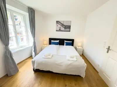 Ein Bett oder Betten in einem Zimmer der Unterkunft Modern Housing Apartments