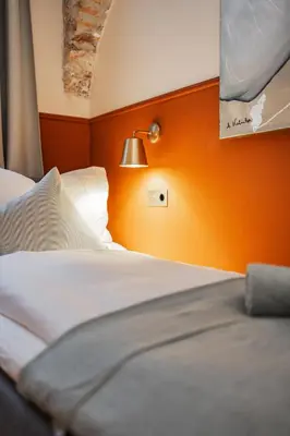 Ein Bett oder Betten in einem Zimmer der Unterkunft HOME1 - Das Kopernikus