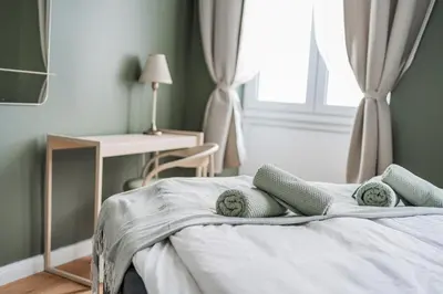 Ein Bett oder Betten in einem Zimmer der Unterkunft HOME1 - Douzième Boutique Hostel