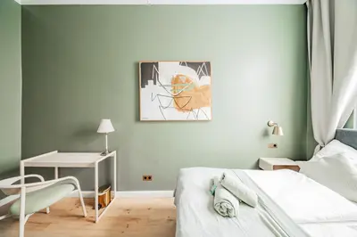 Ein Bett oder Betten in einem Zimmer der Unterkunft HOME1 - Douzième Boutique Hostel
