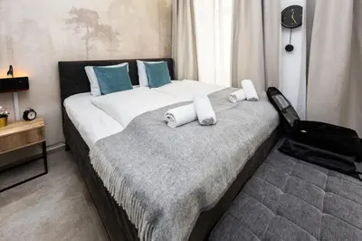 Ein Bett oder Betten in einem Zimmer der Unterkunft Boutique Suite near city centre