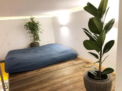 Ein Bett oder Betten in einem Zimmer der Unterkunft Lofty Garden Stay