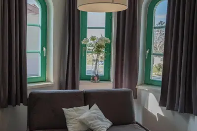 Ein Sitzbereich in der Unterkunft Hotel Am Greiner